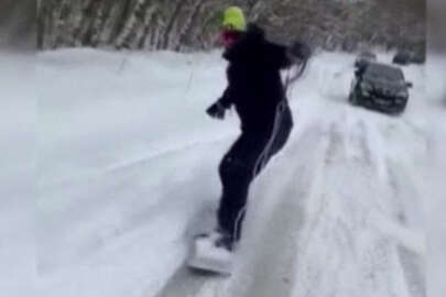 Araca bağladığı iple kayak yaptı! O anlar cep telefonu kamerasına yansıdı