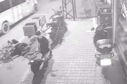 Bisikletten düştü, cep telefonuyla konuşmaya devam etti